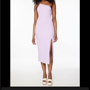 I am selling an asymmetrical backless midi dress/ lace-up back. In size medium
